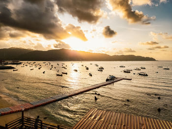 Scenic view of beach against sky during sunset