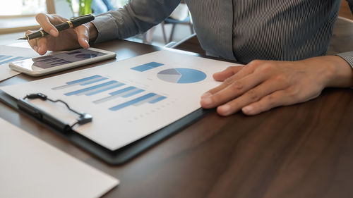 Midsection of businessman working in office