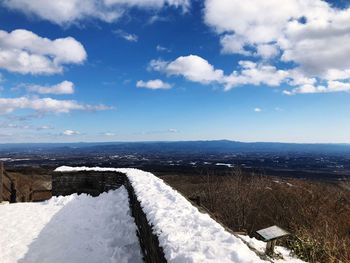 Scenic view of snow covered mountain against sky