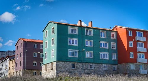 Low angle view of building against blue sky