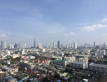 High angle view of modern buildings in city against sky