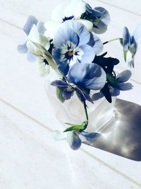 High angle view of white flowering plant in vase on table