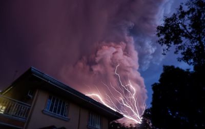 Low angle view of lightning against sky at night