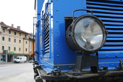 Headlight on an antique blue locomotive