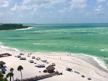 High angle view of people on beach against sky