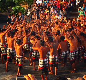 Spectators looking at dancers performing kecak