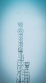 Low angle view of communications tower against sky