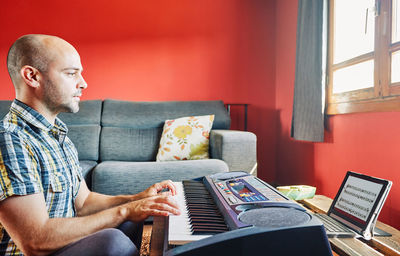 Man sitting on sofa at home