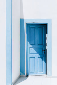 Blue open door in santorini