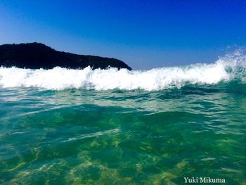 Scenic view of sea against clear blue sky