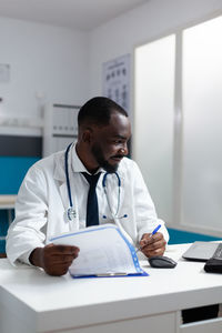 Doctor examining patient at clinic