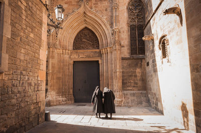 Low angle view of woman walking in corridor