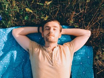 High angle view of a man lying outdoors