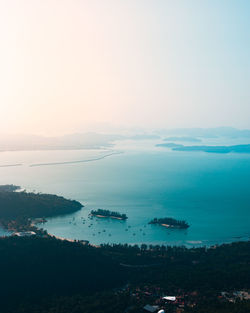 High angle view of sea against sky during sunset