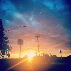 Silhouette city against sky during sunset
