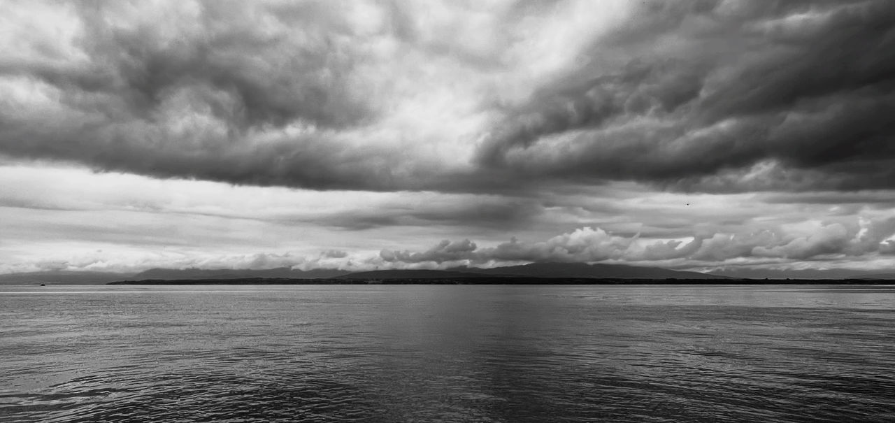 cloud, sky, water, black and white, horizon, beauty in nature, monochrome photography, environment, scenics - nature, monochrome, storm, nature, sea, dramatic sky, storm cloud, no people, cloudscape, landscape, tranquility, overcast, ocean, thunderstorm, coast, outdoors, tranquil scene, darkness, day, wave
