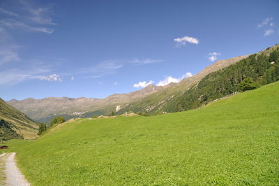 Scenic view of landscape against cloudy sky