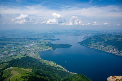 Aerial view of landscape and sea against sky