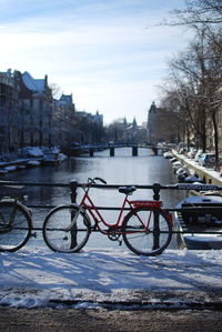 Bicycle parked in city during winter
