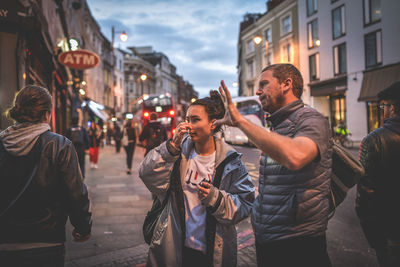 People standing on street in city