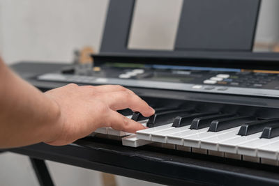 Hands of man playing piano