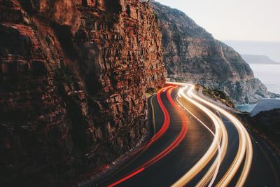 Light trail on mountain road at dusk