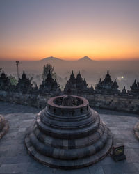 Temple against sky during sunset