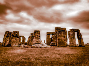 Rock formations on landscape against sky