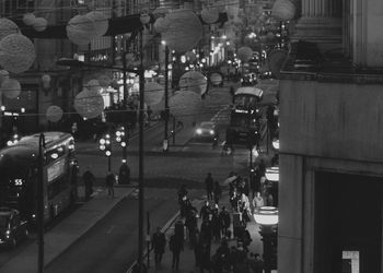 People on street in city at night