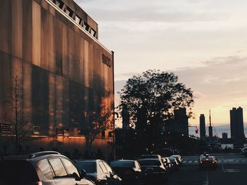 Buildings in city at sunset