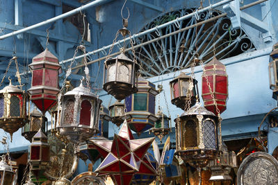 Close-up of shopping carts hanging from metal