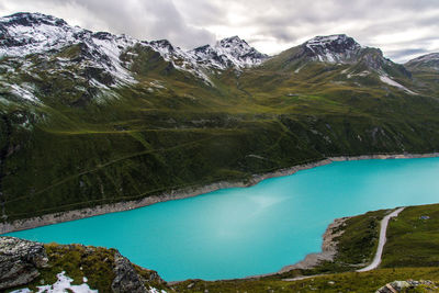 Scenic view of lake and mountains against sky
