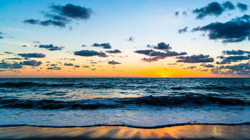 Scenic view of sea against sky during sunrise 