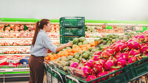 Full length of man standing at market stall