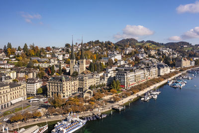 Switzerland, canton of lucerne, lucerne, aerial view of lakeshore city in autumn