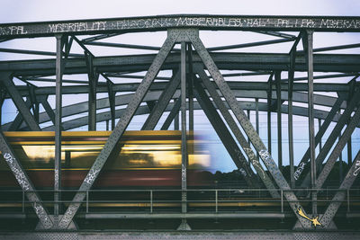 Blurred motion of train on railway bridge