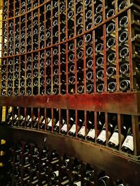 Full frame shot of beer bottles on rack