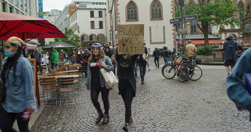 People walking on street in city