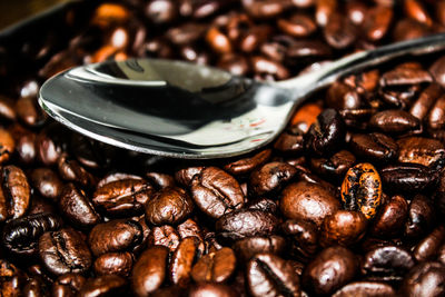 Close-up of coffee beans on table