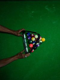 High angle view of hand playing with ball