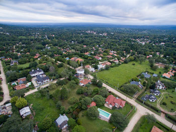 High angle view of buildings in city against sky