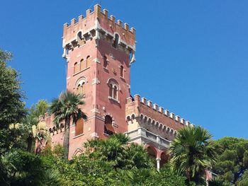 Low angle view of clock tower against sky