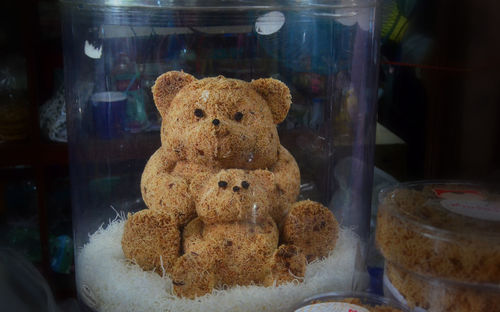 Close-up of teddy bear in glass
