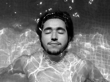 Young man in swimming pool