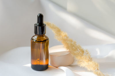 Essential oil or serum in a brown bottle with a dropper. cosmetics, body care.