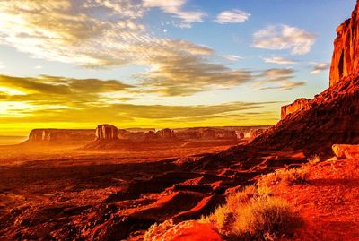 Scenic view of landscape against cloudy sky