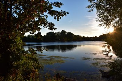 Scenic view of lake against sky during sunset