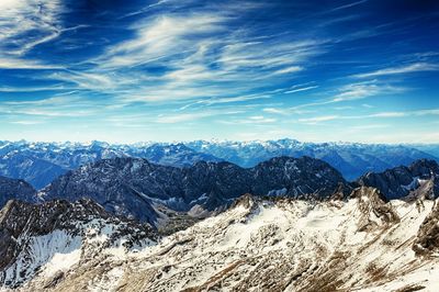 Scenic view of mountains against blue sky during sunset