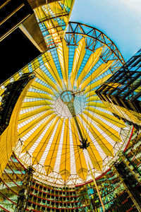 Low angle view of illuminated ferris wheel against sky