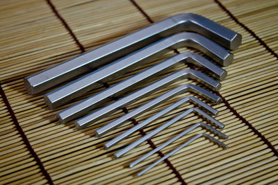 High angle view of silver spanners